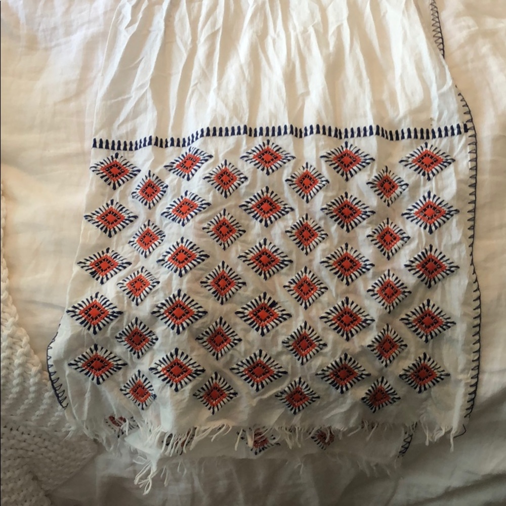 White, orange, and blue scarf. Light.